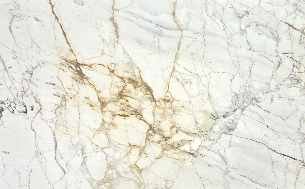 White marble slab with bold gold and gray veining